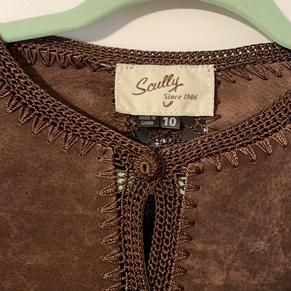 Leather jacket with covered buttons.